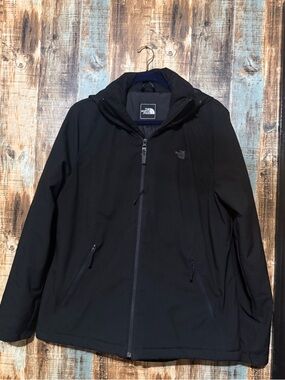 The North Face Women’s  Black Hooded Coat. Hood zips off and has pockets. Xl